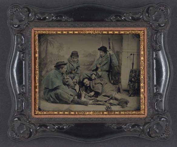 A soldier of the 11th Vermont (1st Vermont Heavy Artillery) poses with soldiers from three other regiments (Library of Congress)